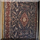 R51. Handknotted 100% wool rug with blue ground. Made in Pakistan. 8' x 10'4”